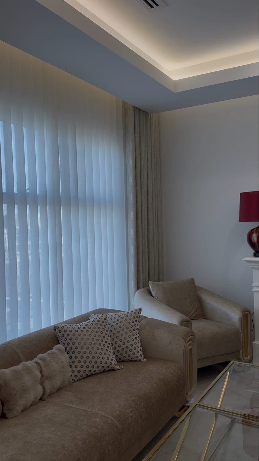 Sheer curtain with patterned decor side curtains in a lounge