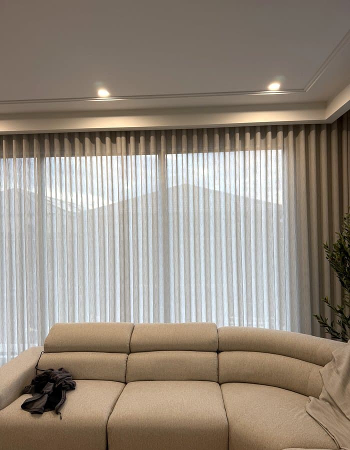 Soft cream sheer curtains in a living room