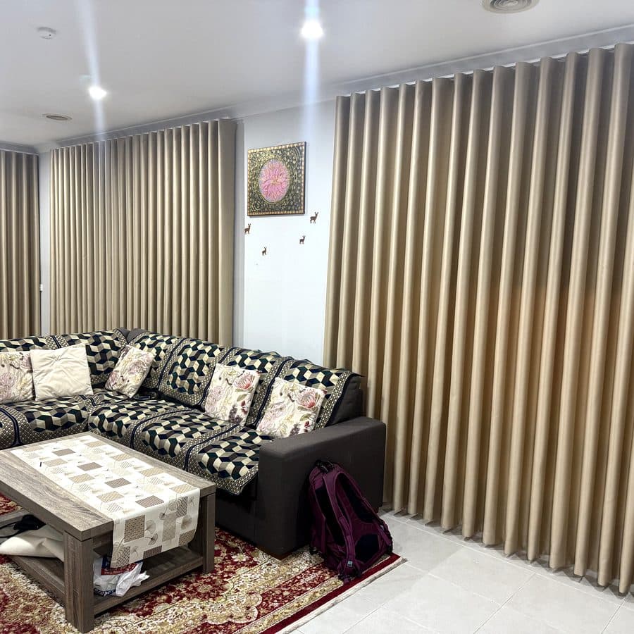 Gold blockout curtains in a warm living room