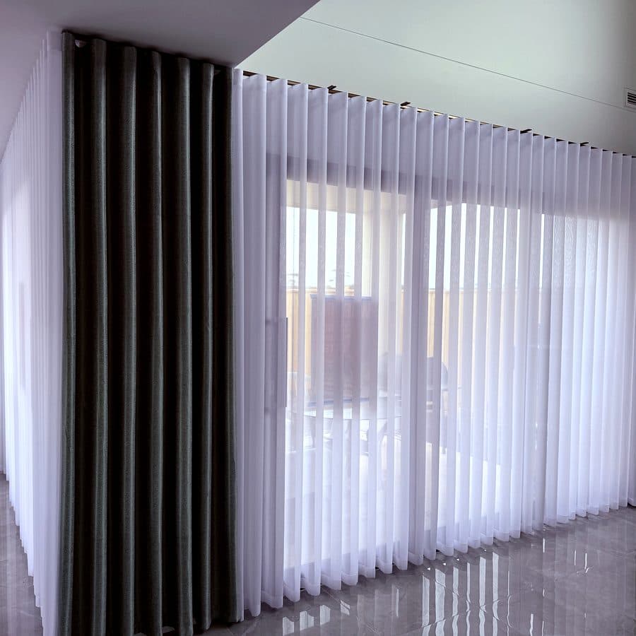 White sheer curtains in a bright Melbourne living room