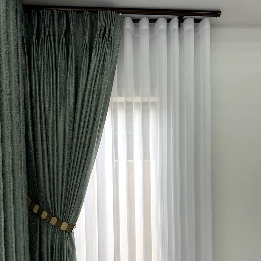 Layered S-fold curtains in a modern home